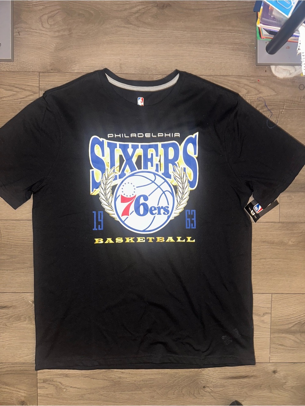 NBA Philadelphia Sixers Black T‑Shirt with Blue, Yellow and Red Logo
